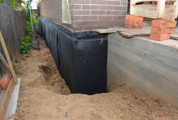 Happy homeowners after waterproofing job in Allentown